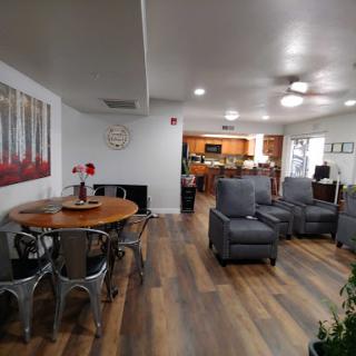 A cozy and modern living space featuring a dining area and comfortable seating.