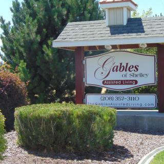 Entrance sign to Gables at Charlestowne neighborhood surrounded by landscaping.