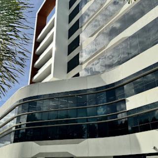 A modern architectural building featuring glass facades and sleek design.