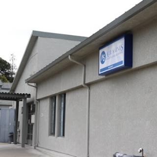 A view of a commercial building showcasing its exterior and signage.