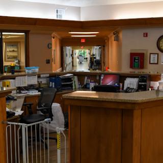 A view of a reception area featuring desks, computers, and an inviting workspace.
