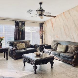 A cozy living room with elegant leather sofas and a stylish coffee table.