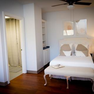A modern bedroom with a comfortable bed and stylish decor.