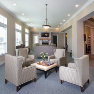 A modern living room with comfortable seating and an open kitchen layout.