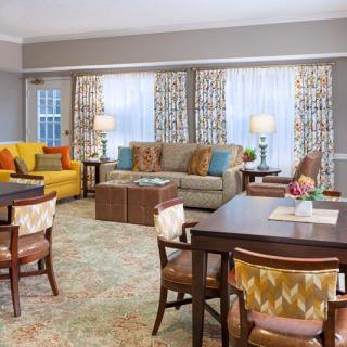 A cozy living room with colorful furniture and elegant decor.