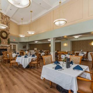An elegant dining room with neatly arranged tables and tasteful decor.