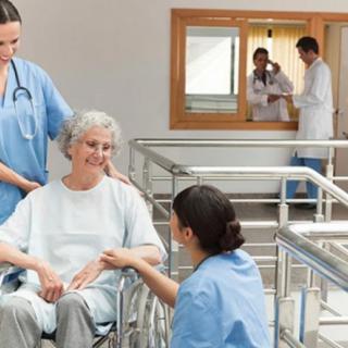 Medical staff attending to a patient in a hospital setting.