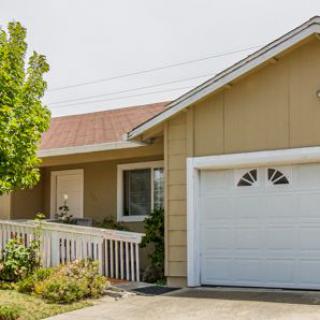 A suburban house with a garage and front yard.
