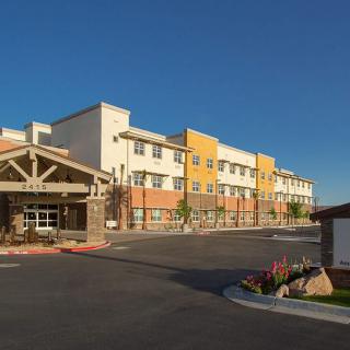 A modern hotel building with a colorful exterior and architectural design.