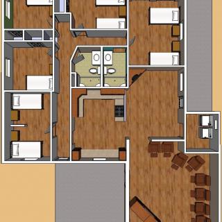 A detailed floor plan of a residential space featuring multiple rooms, a kitchen area, bathrooms, and furniture arrangements.