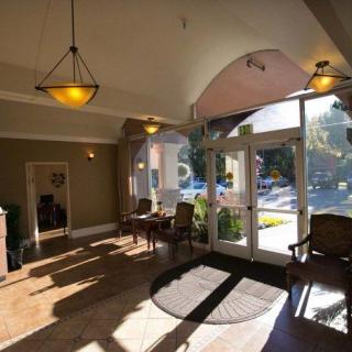 A well-lit lobby with comfortable seating and large windows.
