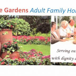 Promotional image for an adult family home featuring a garden and elderly individuals enjoying a meal together.