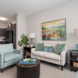 A modern living room with comfortable seating and stylish decor.