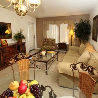 A cozy living room with elegant furniture and warm lighting.