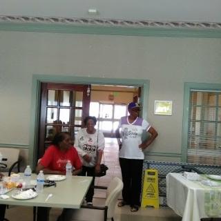 A group of people participating in a community event indoors.
