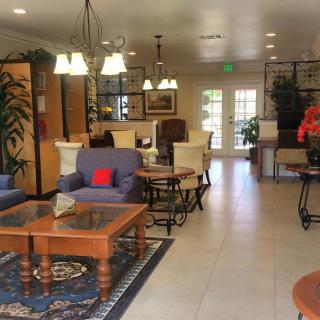 A cozy living room with comfortable seating and elegant decor.