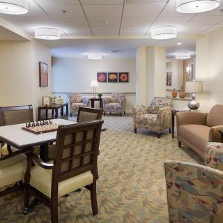 A cozy living room with comfortable seating and elegant decor.