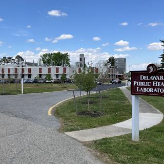 The Delaware Public Health Laboratory, showcasing its facility and surrounding landscape.