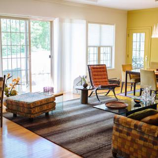 A bright and inviting living room with modern furnishings and a cozy atmosphere.