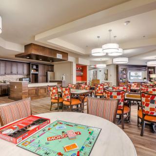 A cozy dining area with a Monopoly board game set up on a table.