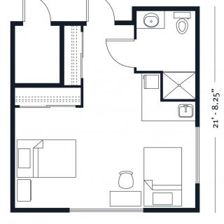 A compact one-bedroom apartment floor plan with a bathroom and kitchen area.