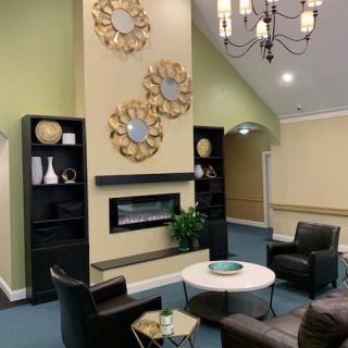 A modern living room with stylish decor and comfortable seating.
