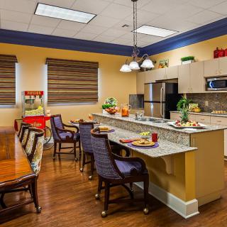 A modern kitchen and dining area featuring a sleek design with ample seating and contemporary appliances.