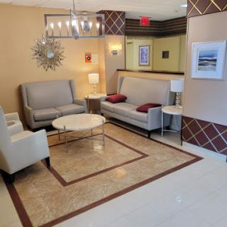 A stylish and inviting lobby featuring modern seating arrangements and elegant lighting.
