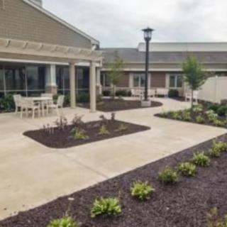 A landscaped courtyard with outdoor seating and walkways between buildings.