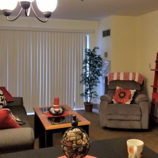 A cozy living room with stylish decorations and comfortable seating.
