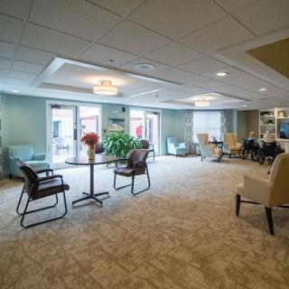 A spacious and well-lit lobby with comfortable seating and large windows.