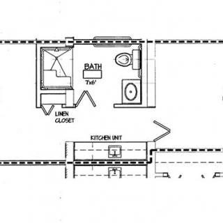 A section of a floor plan showing a bathroom, closet, and part of the kitchen layout.