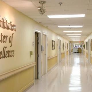 A clean and well-lit hallway in a rehabilitation center.