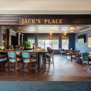 Interior view of Jack's Place bar and restaurant with seating and a welcoming atmosphere.