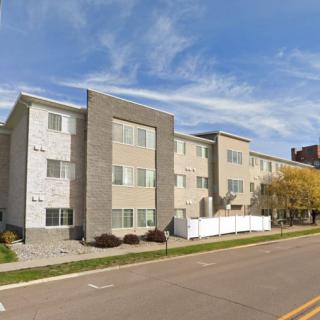A modern apartment building along a residential street.