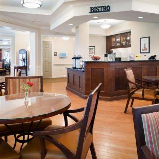 A cozy cafe interior with wooden furniture and a welcoming atmosphere.