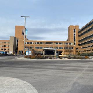 A modern hospital building showcasing its architectural design.