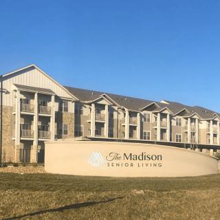 The Madison Senior Living complex on a clear day.