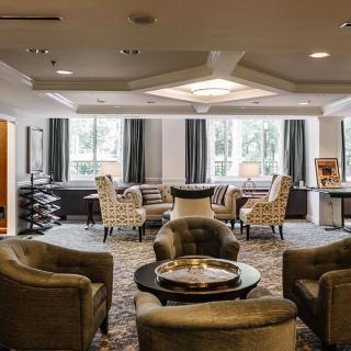 Spacious lobby with comfortable seating and large windows.