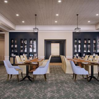 A stylish and elegant dining area with modern furniture and a cozy ambiance.