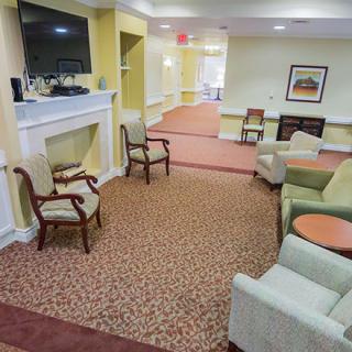 A cozy living room with comfortable seating and a television.