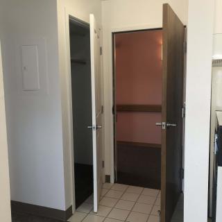 Interior view showing open doors leading to different rooms.