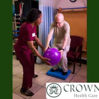 A healthcare professional assists a patient during a physical therapy session, focusing on balance and mobility.