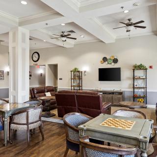 A cozy living room with comfortable seating and a TV area.
