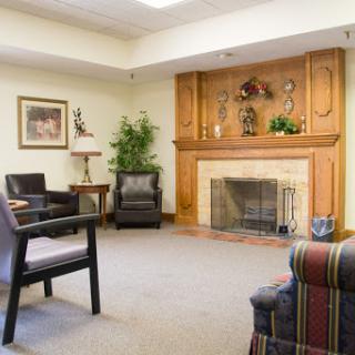 A cozy living room featuring a fireplace and comfortable seating.