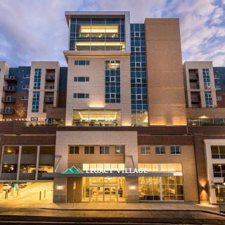 Modern hospital building exterior at night.