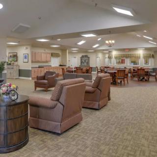 A spacious lounge area with comfortable seating and elegant decor.