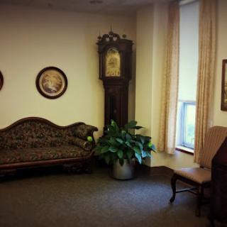 A cozy corner of a room featuring vintage furniture and decor.