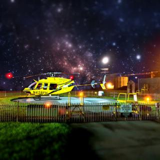 A vibrant yellow helicopter sits under a starry night sky, blending urban transportation with the vastness of space.