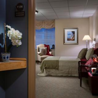 A cozy hotel room with elegant decor and comfortable furnishings.